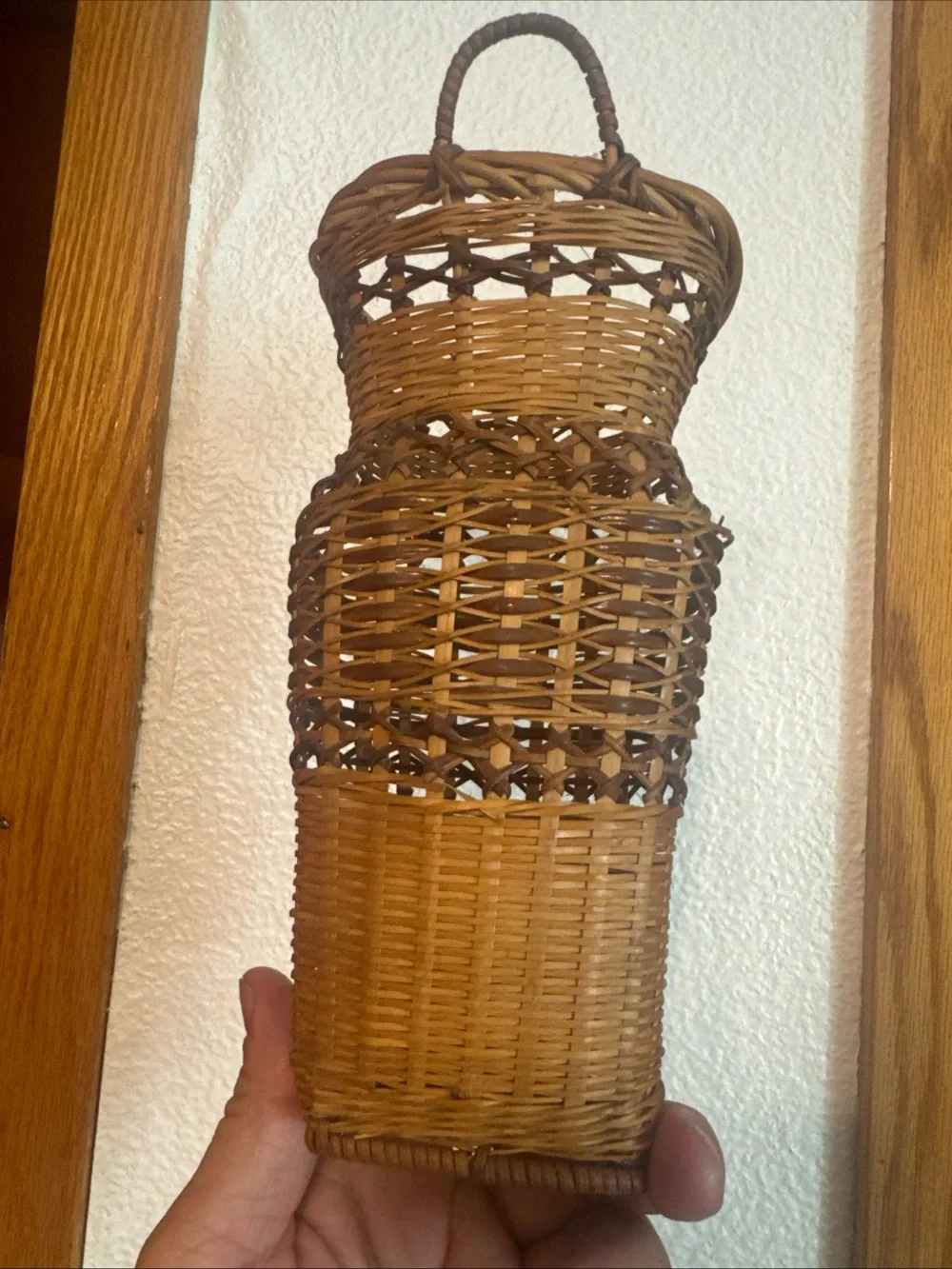vintage two-toned woven wicker wall pocket basket